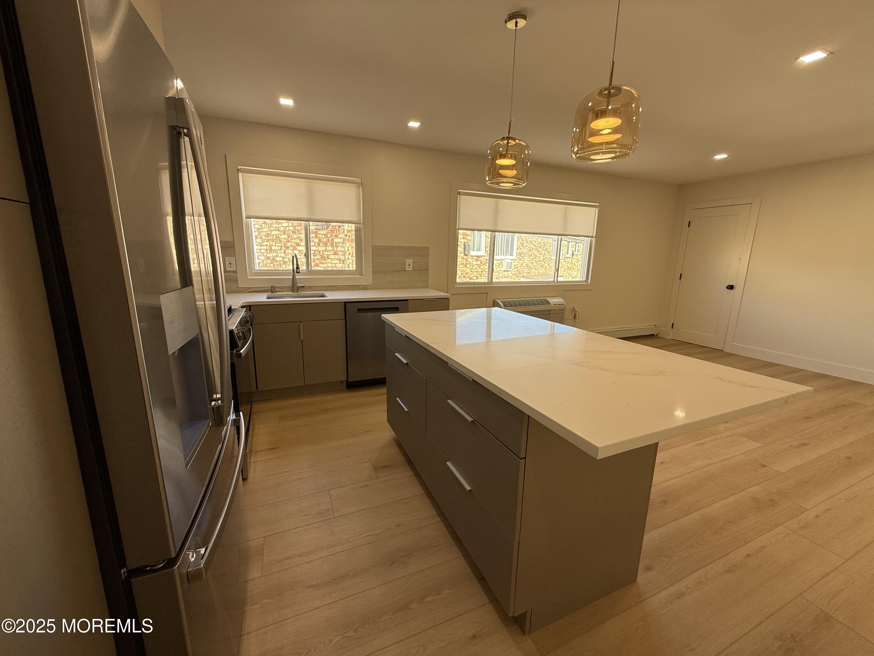 1 North Ocean Avenue, Unit 18 Belmar, NJ 07719 - Photo 4 of 10 a large kitchen with a large window