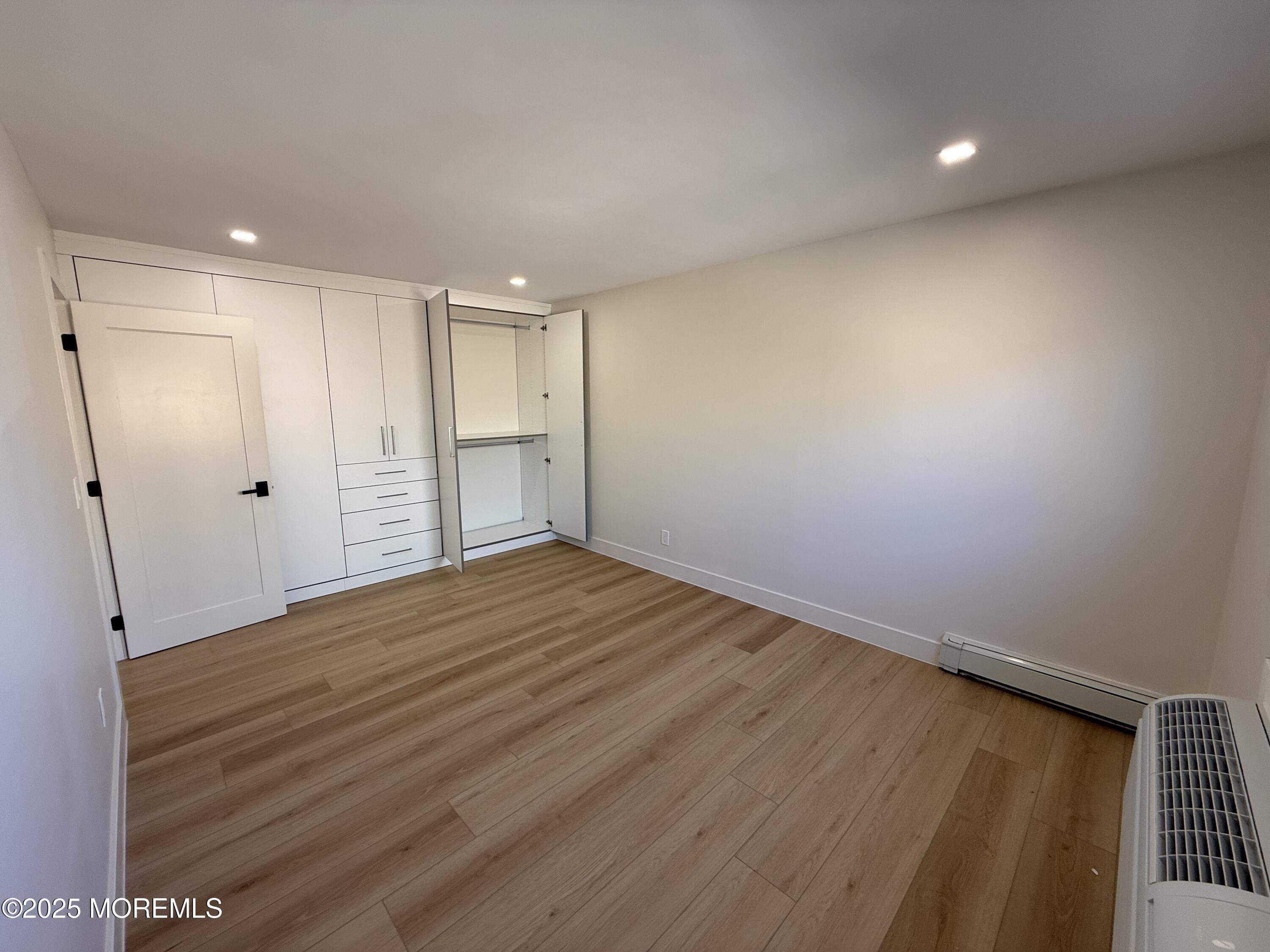 1 North Ocean Avenue, Unit 18 Belmar, NJ 07719 - Photo 9 of 10 a view of empty room with wooden floor