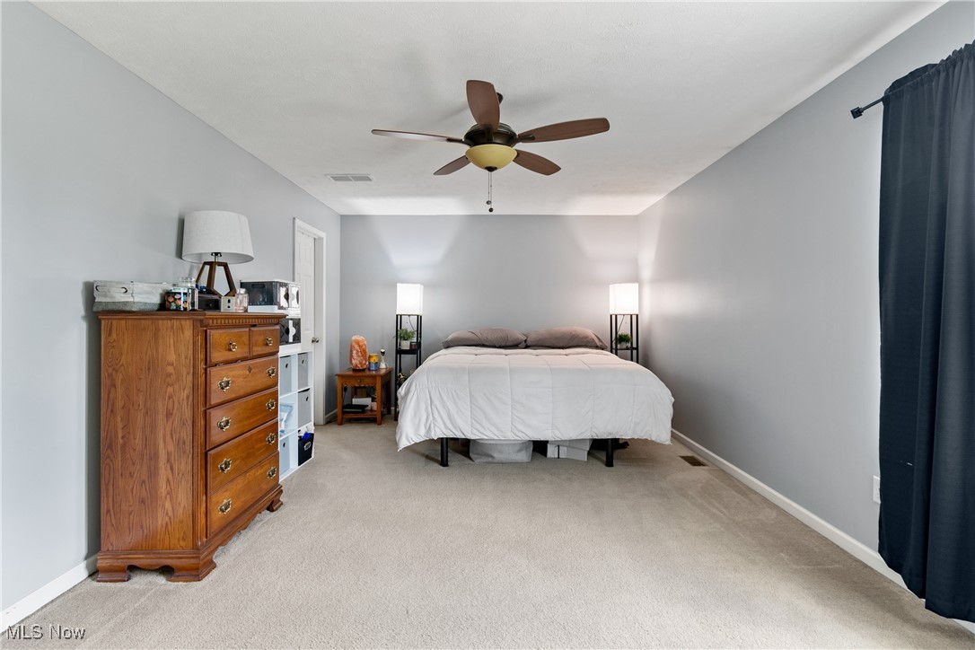 4467 Ridgestone Way Medina, OH 44256 - Photo 15 of 31 Carpeted bedroom with ceiling fan