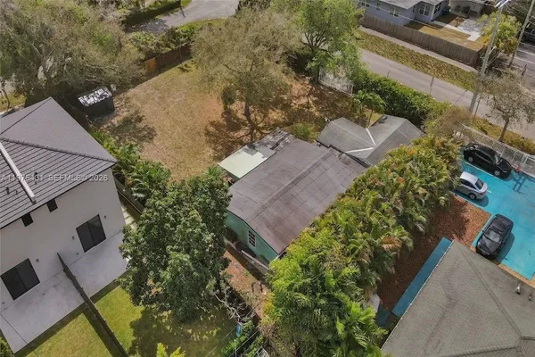an aerial view of house with yard