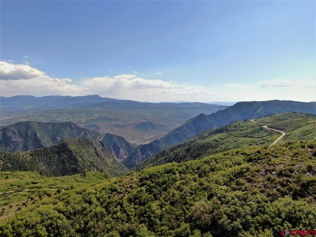 Tbd Highway 92 Crawford, CO 81415 - Photo 6 of 17 a view of a lush green field with mountains in the background