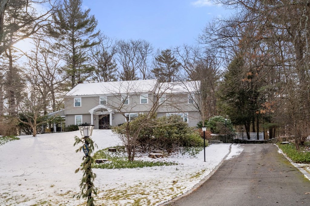 23 Colgate Road Wellesley, MA 02482 - Photo 1 of 32 a view of a house with a yard covered in snow