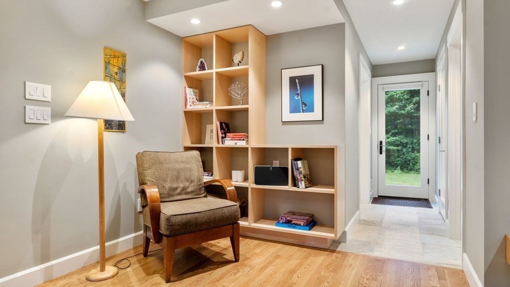 23 Colgate Road Wellesley, MA 02482 - Photo 14 of 32 a living room with furniture and a fireplace