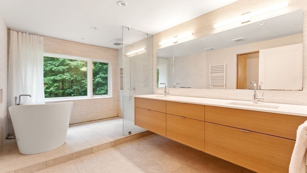 23 Colgate Road Wellesley, MA 02482 - Photo 20 of 32 a bathroom with a tub sink and mirror