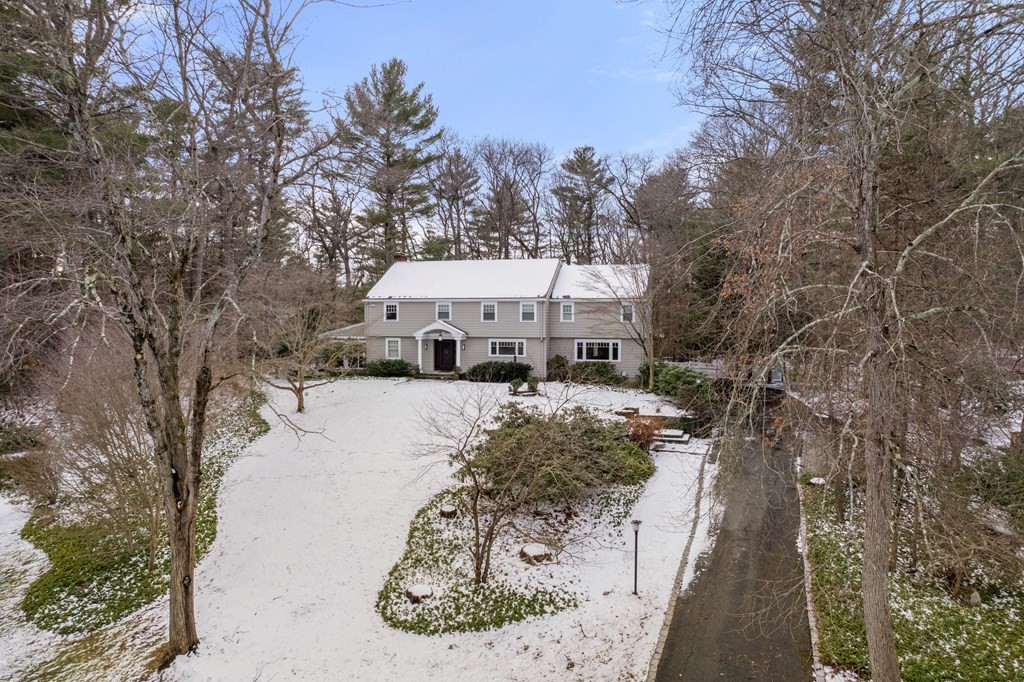 23 Colgate Road Wellesley, MA 02482 - Photo 2 of 32 a view of a house with a yard covered with snow