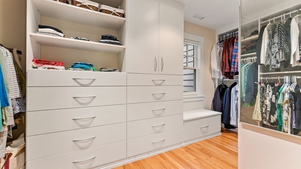 23 Colgate Road Wellesley, MA 02482 - Photo 22 of 32 a view of walk in closet with clothes and shoes