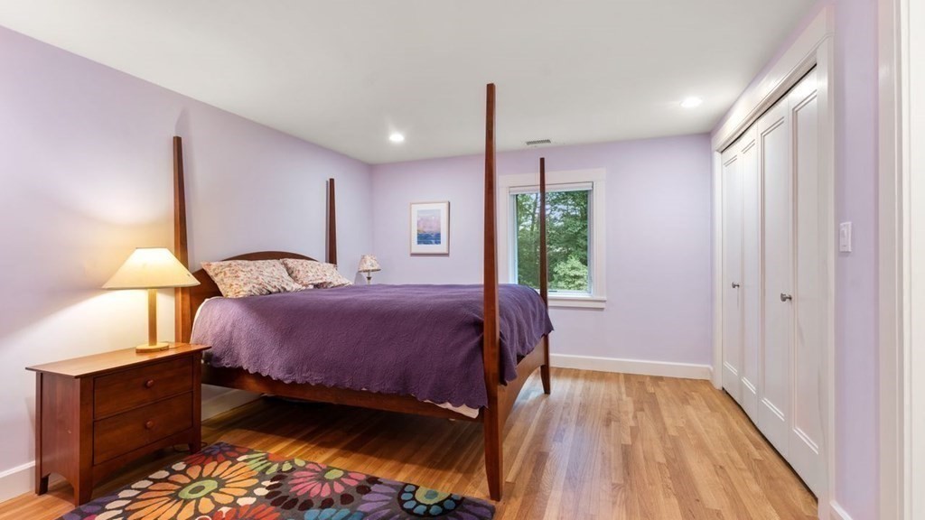 23 Colgate Road Wellesley, MA 02482 - Photo 23 of 32 a bedroom with a bed window and a wooden floor