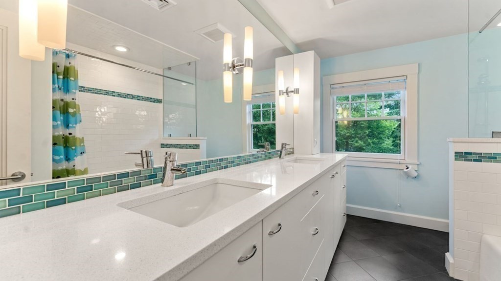 23 Colgate Road Wellesley, MA 02482 - Photo 26 of 32 a bathroom with a sink and a large mirror