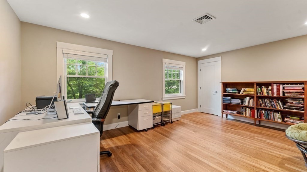 23 Colgate Road Wellesley, MA 02482 - Photo 27 of 32 a view of a workspace with furniture and a book shelf