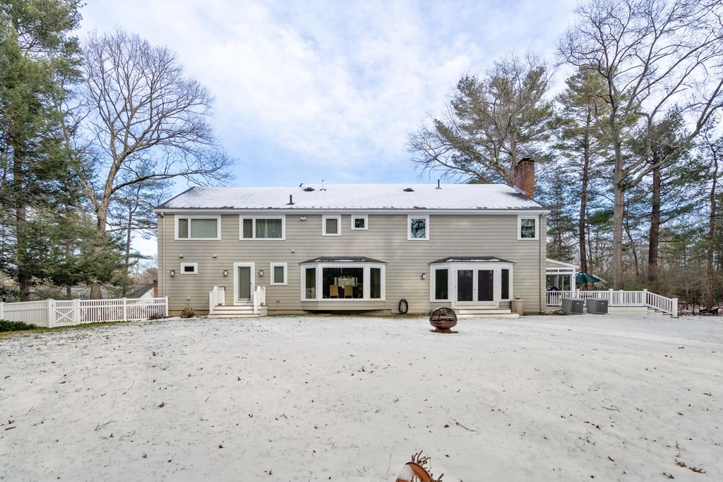 23 Colgate Road Wellesley, MA 02482 - Photo 3 of 32 a front view of a building with large trees