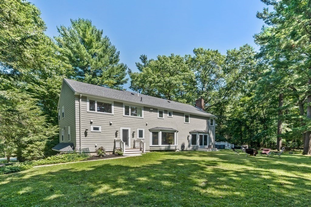 23 Colgate Road Wellesley, MA 02482 - Photo 31 of 32 a front view of a house with a garden