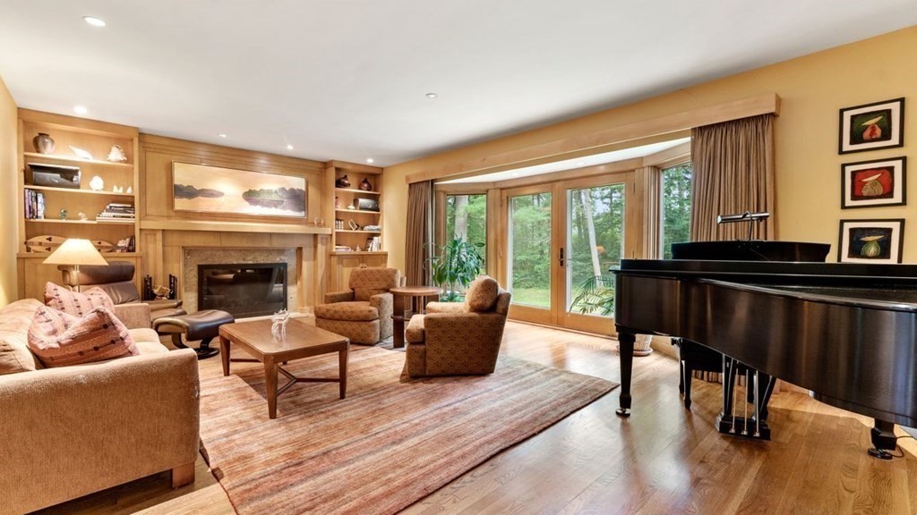 23 Colgate Road Wellesley, MA 02482 - Photo 6 of 32 a living room with furniture and a fireplace