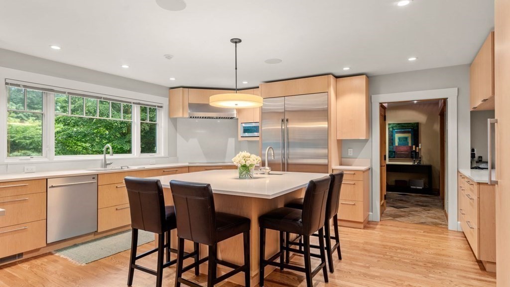 23 Colgate Road Wellesley, MA 02482 - Photo 9 of 32 a dining room with furniture a chandelier and wooden floor