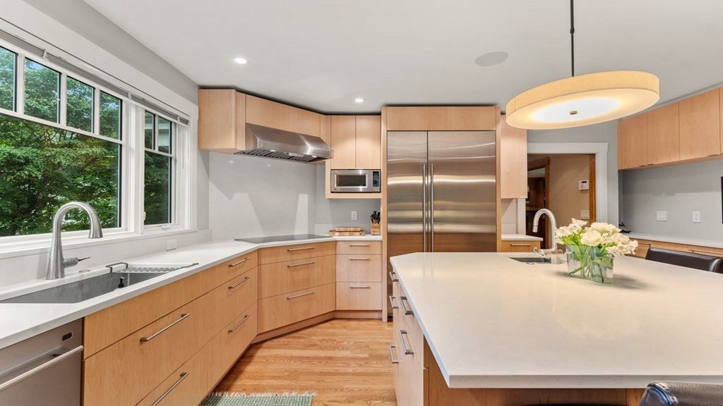 23 Colgate Road Wellesley, MA 02482 - Photo 10 of 32 a large white kitchen with a large window