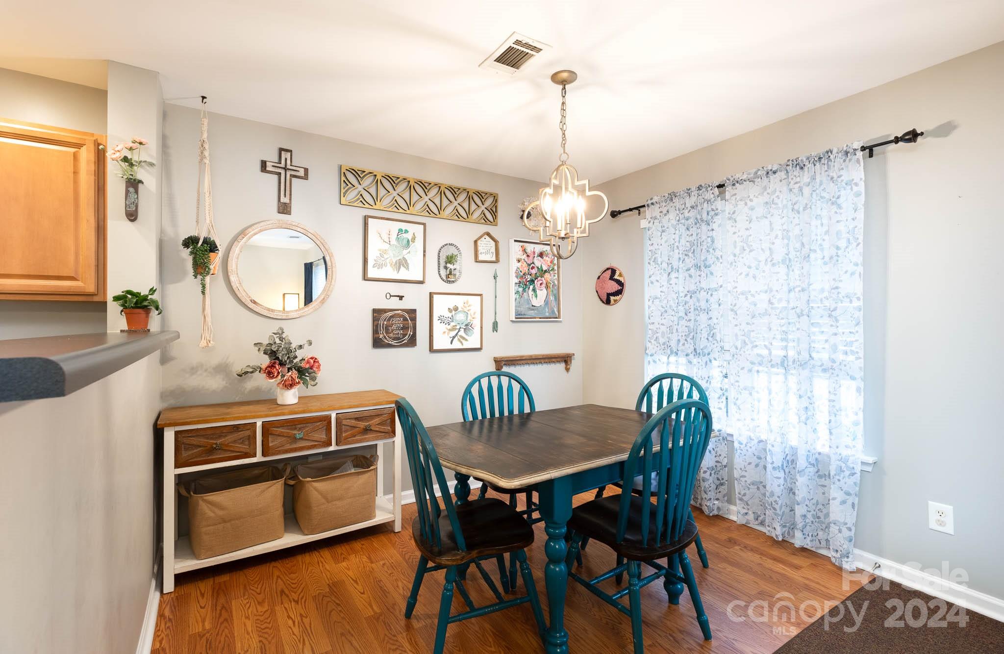 1681 Alpine Ridge Place Rock Hill, SC 29732 - Photo 5 of 20 a view of a dining room with furniture window and wooden floor