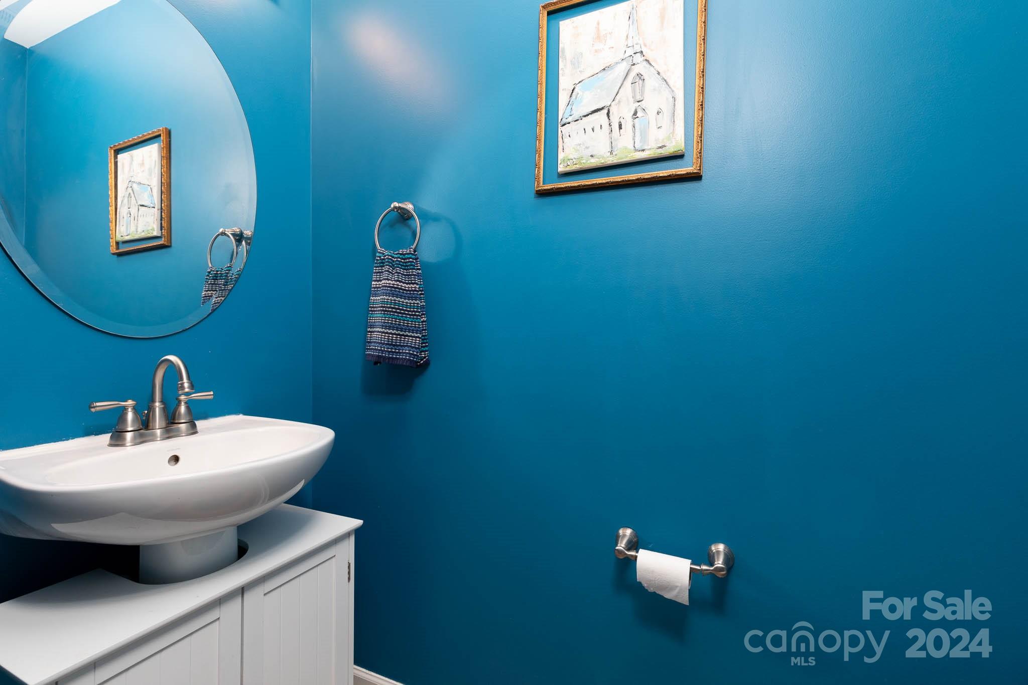 1681 Alpine Ridge Place Rock Hill, SC 29732 - Photo 8 of 20 a bathroom with a toilet sink and mirror