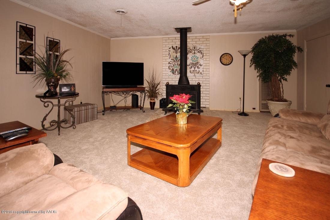 4213 Farmers Avenue Amarillo, TX 79110 - Photo 5 of 24 a living room with furniture and a flat screen tv