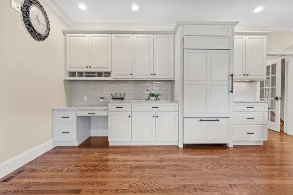 a view of kitchen with cabinets and wooden floor