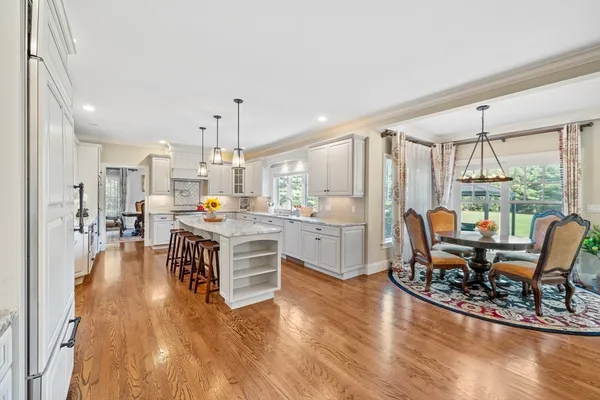 a living room with kitchen island furniture and a large window