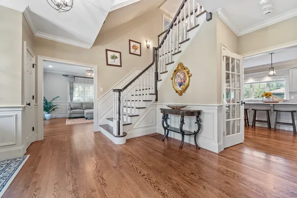 a view of an entryway with wooden floor