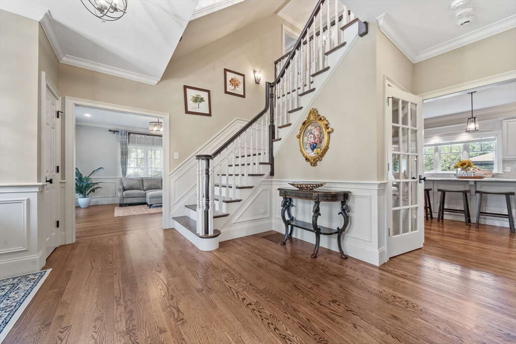 18 Victory Garden Way Lexington, MA 02420 - Photo 18 of 42 a view of an entryway with wooden floor