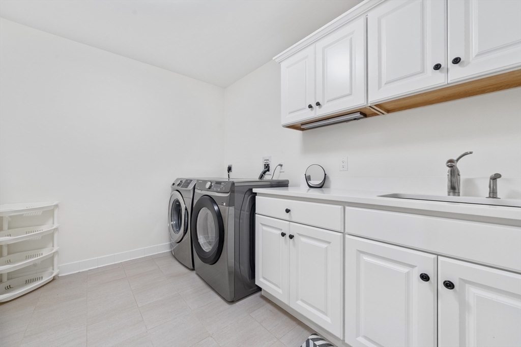 18 Victory Garden Way Lexington, MA 02420 - Photo 27 of 42 a utility room with dryer and washer
