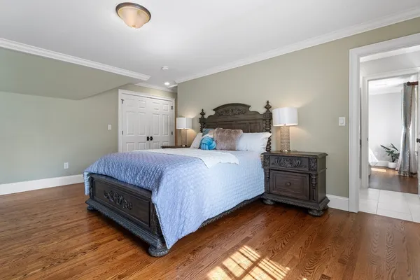 a bed room with a bed and a night stand