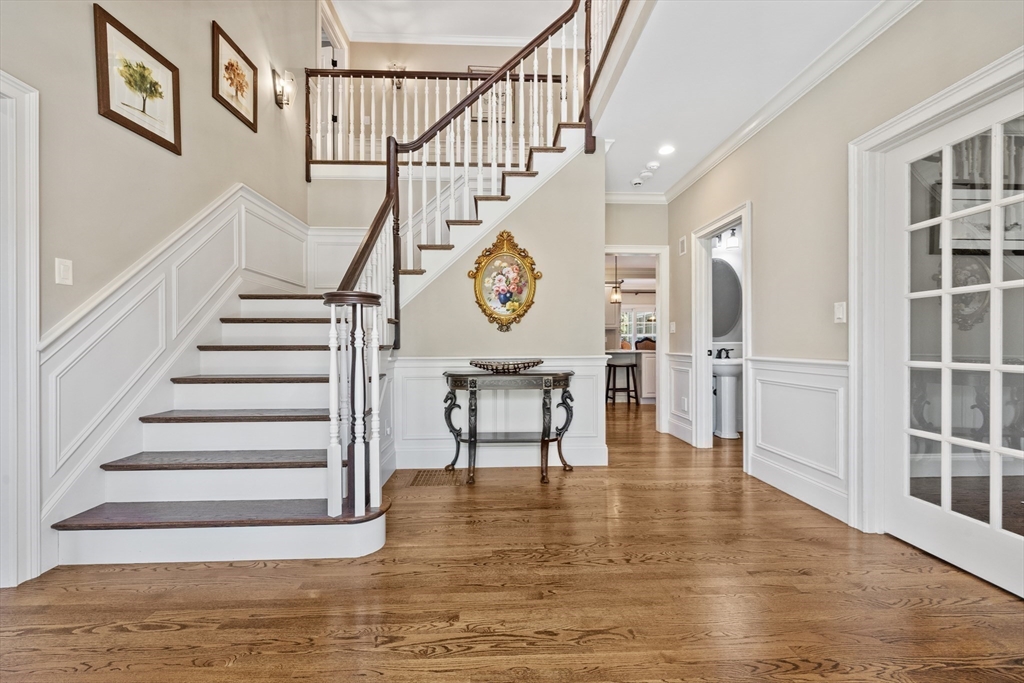 18 Victory Garden Way Lexington, MA 02420 - Photo 3 of 42 a view of entryway and hall with wooden floor