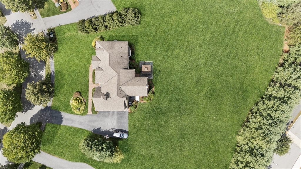 18 Victory Garden Way Lexington, MA 02420 - Photo 41 of 42 an aerial view of a house with a yard