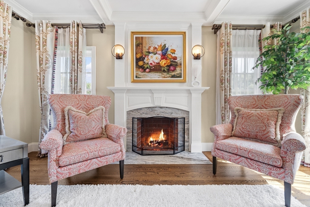 18 Victory Garden Way Lexington, MA 02420 - Photo 10 of 42 a living room with furniture and a fireplace