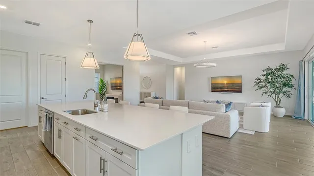 a bathroom with a granite countertop sink toilet and mirror