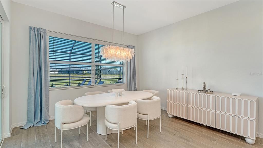 17160 Albatross Road Venice, FL 34293 - Photo 17 of 91 a dining room with furniture and window