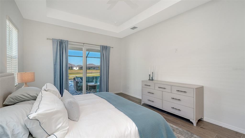17160 Albatross Road Venice, FL 34293 - Photo 20 of 91 a bedroom with a bed and a window