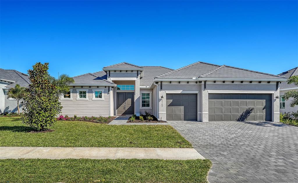 17160 Albatross Road Venice, FL 34293 - Photo 2 of 91 a front view of a house with a yard