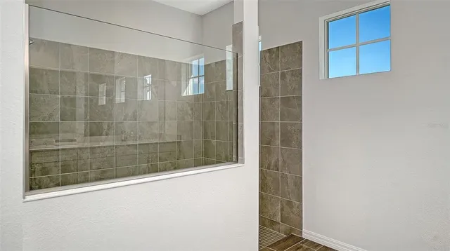 a view of a swimming pool with a yard and sitting area