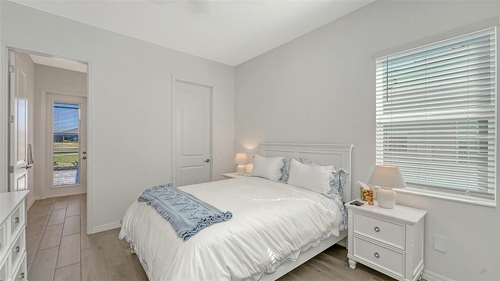 17160 Albatross Road Venice, FL 34293 - Photo 29 of 91 a bedroom with a bed and a window