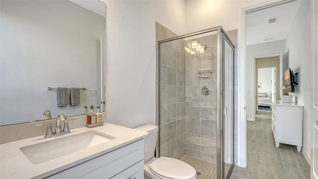 17160 Albatross Road Venice, FL 34293 - Photo 32 of 91 a bathroom with a sink toilet and shower