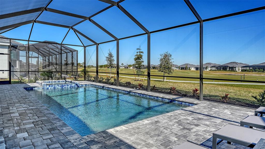17160 Albatross Road Venice, FL 34293 - Photo 38 of 91 a view of a swimming pool with a yard