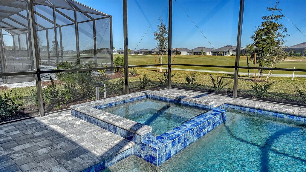 17160 Albatross Road Venice, FL 34293 - Photo 39 of 91 a view of a swimming pool with a yard and sitting area