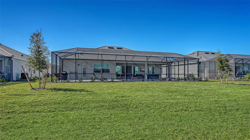 17160 Albatross Road Venice, FL 34293 - Photo 41 of 91 a view of a house with a big yard