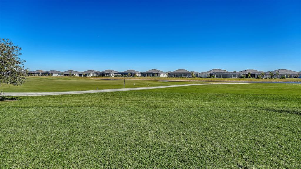 17160 Albatross Road Venice, FL 34293 - Photo 44 of 91 a view of an ocean from a yard