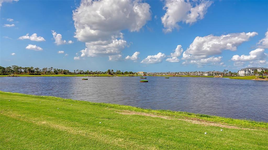17160 Albatross Road Venice, FL 34293 - Photo 50 of 91 a view of a lake with houses in the back