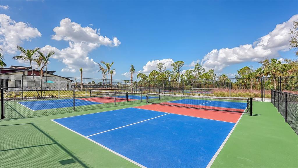 17160 Albatross Road Venice, FL 34293 - Photo 54 of 91 a view of an outdoor space and tennis court