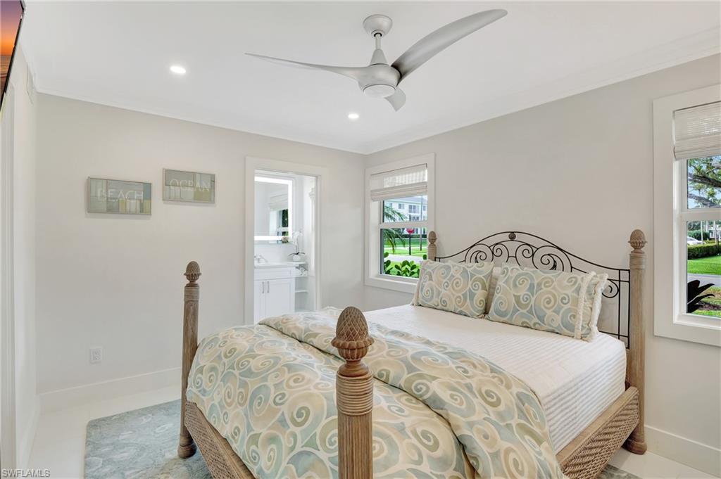 603 12th Avenue South Naples, FL 34102 - Photo 13 of 47 a bedroom with a bed and a window