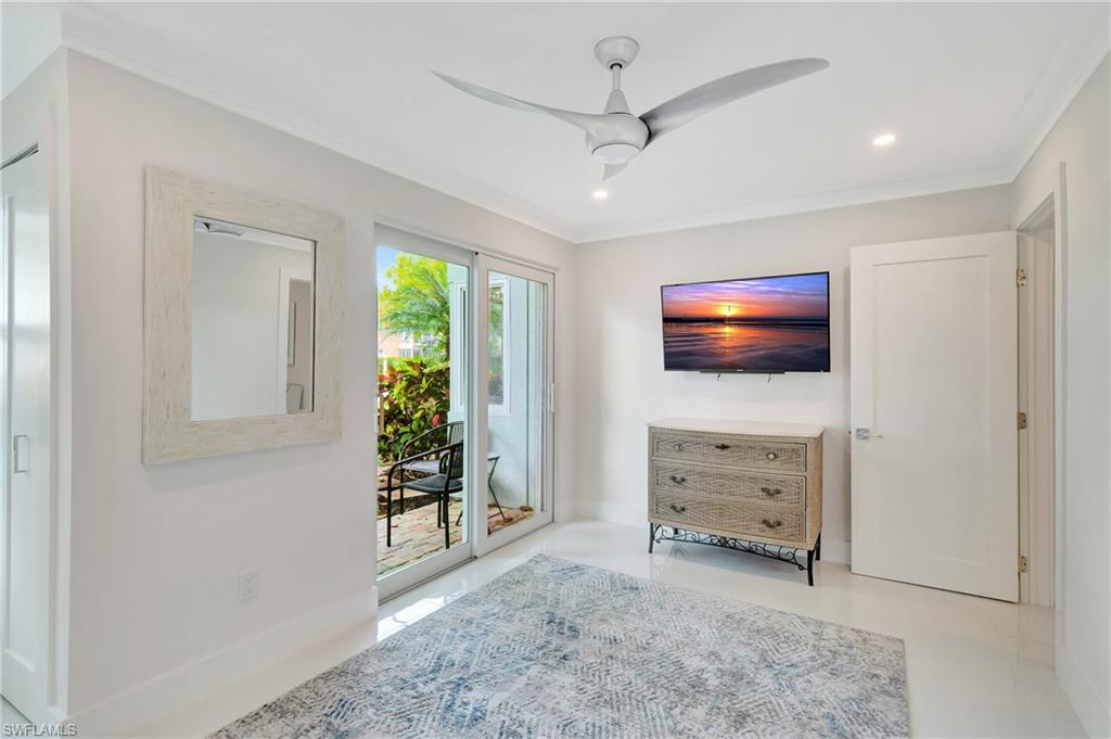 603 12th Avenue South Naples, FL 34102 - Photo 20 of 47 a view of room with window and flat screen tv