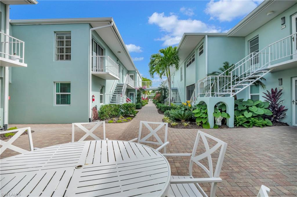 603 12th Avenue South Naples, FL 34102 - Photo 23 of 47 a view of a house with backyard and sitting area
