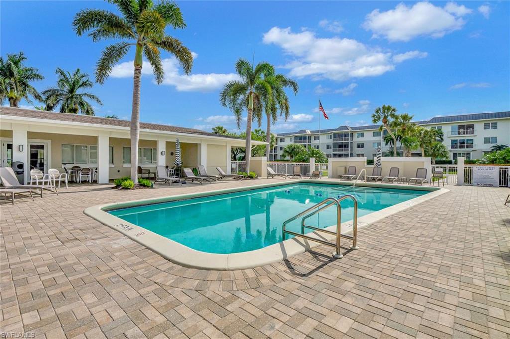 603 12th Avenue South Naples, FL 34102 - Photo 37 of 47 a view of a swimming pool with a patio