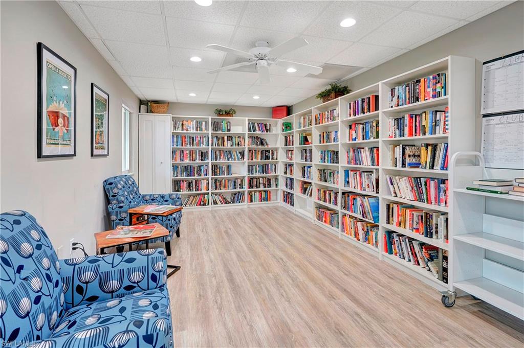 603 12th Avenue South Naples, FL 34102 - Photo 38 of 47 a room with furniture and a book shelf