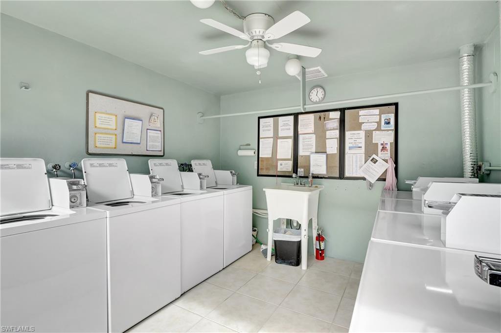 603 12th Avenue South Naples, FL 34102 - Photo 42 of 47 a living room with furniture and a window