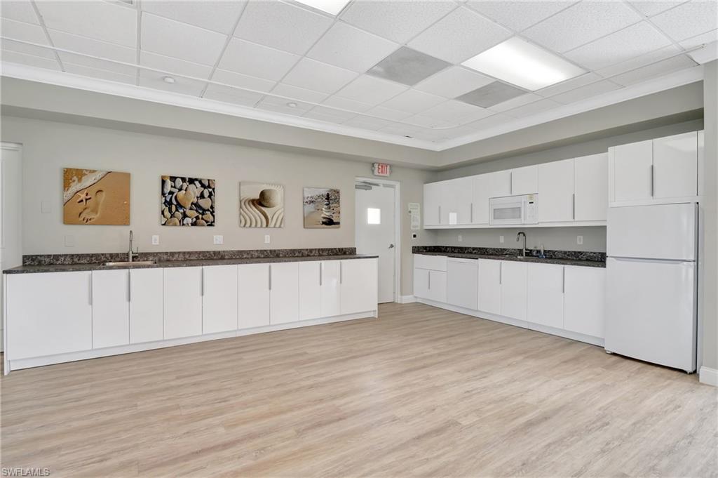 603 12th Avenue South Naples, FL 34102 - Photo 44 of 47 a view of kitchen with wooden floor